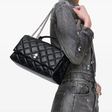 black bags worn by a person, showing the bags fit