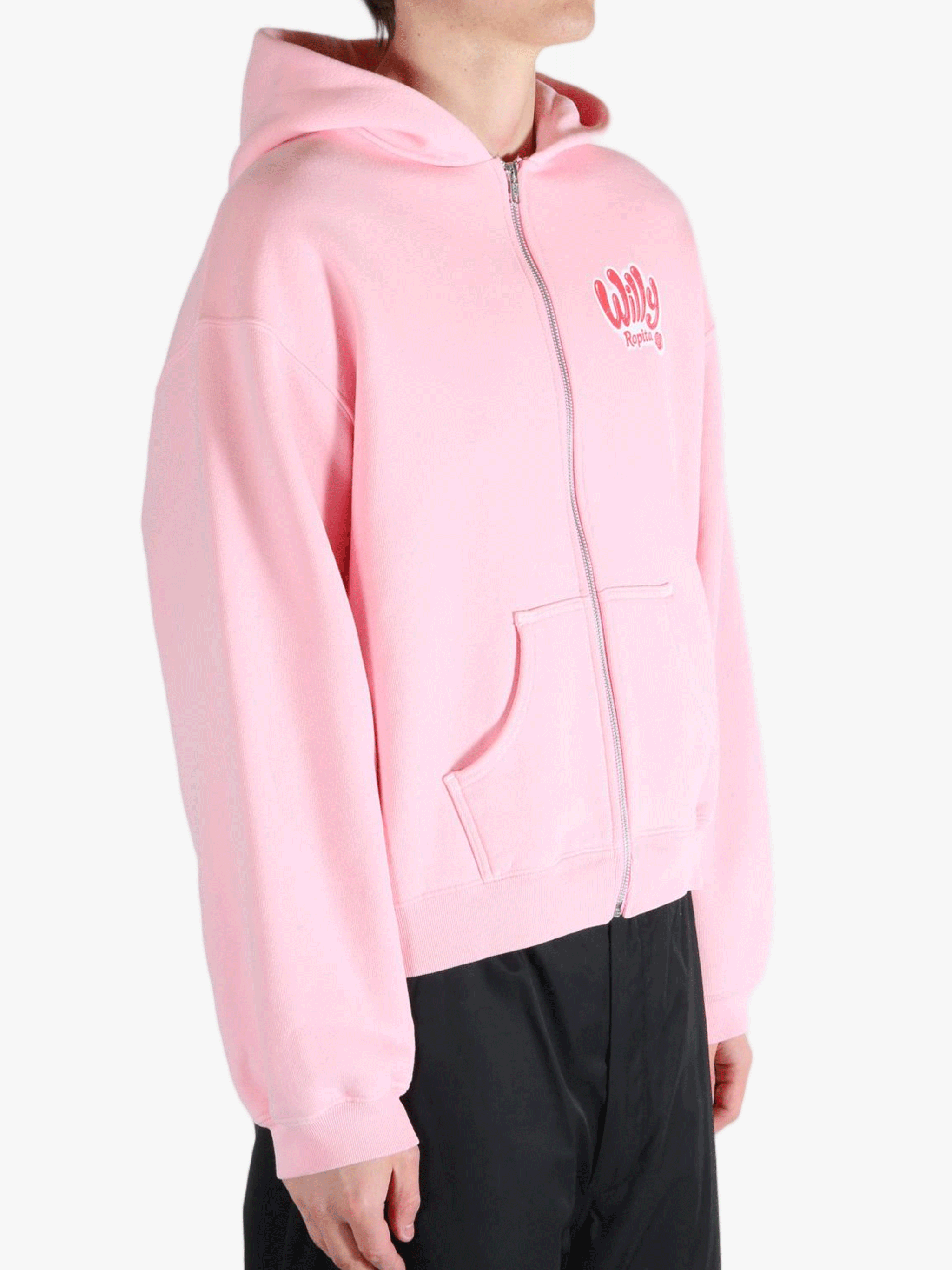 Pink hoodie worn by a person, showing the hoodie's fit