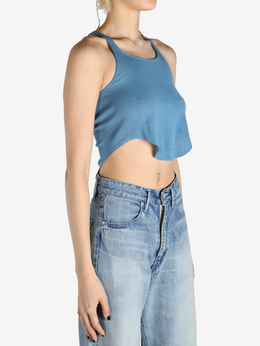 Blue tops worn by a person, showing the tops fit