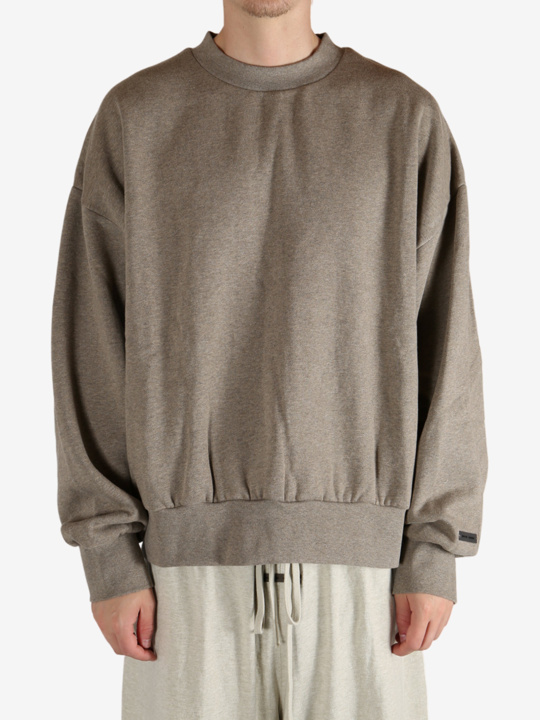 Grey tops worn by a person, showing the  tops fit