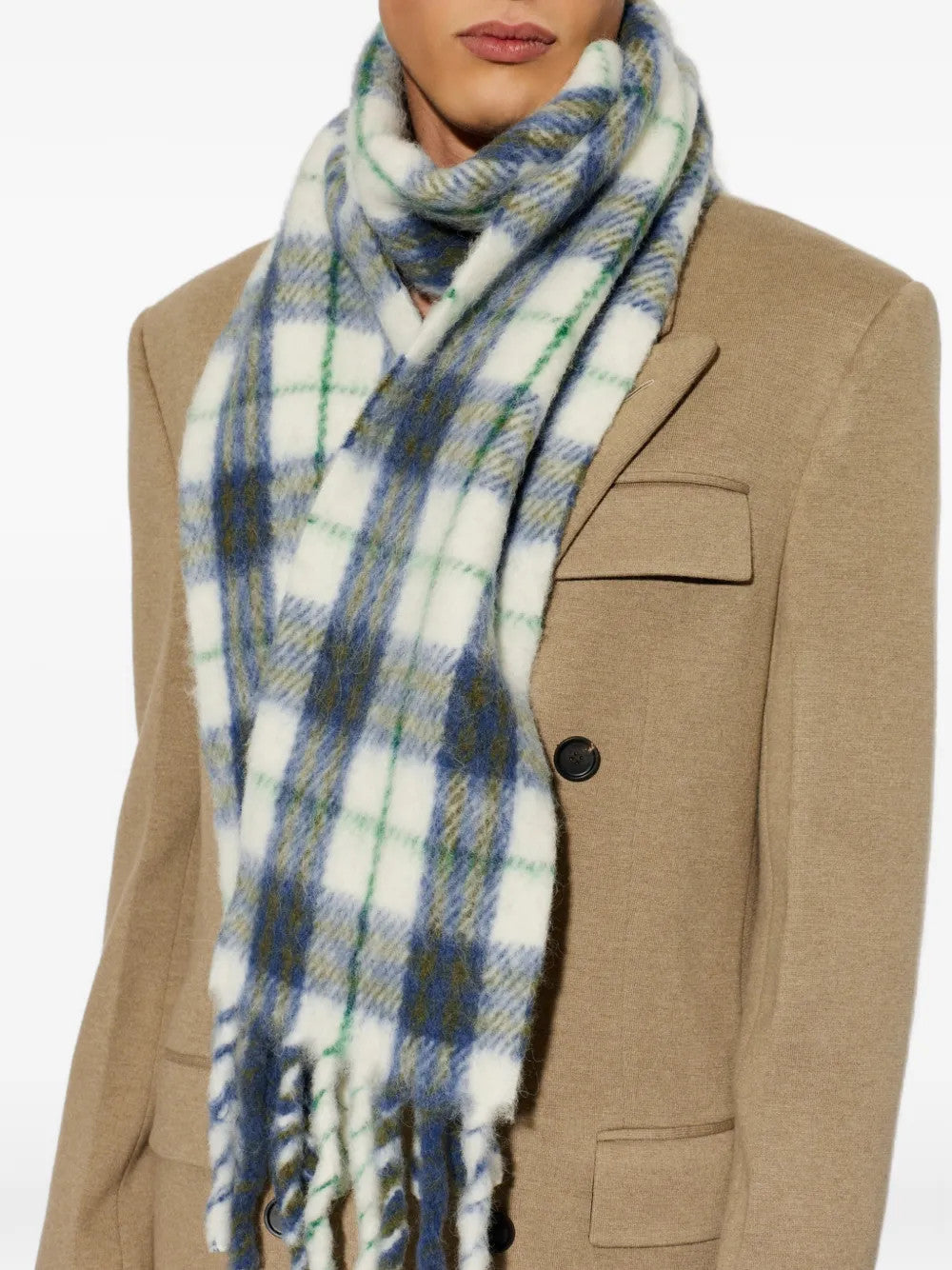 Blue scarf worn by a person, showing the scarf fit