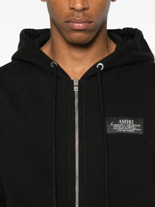 Close up of the black hoodie, showing texture of the cotton fabric