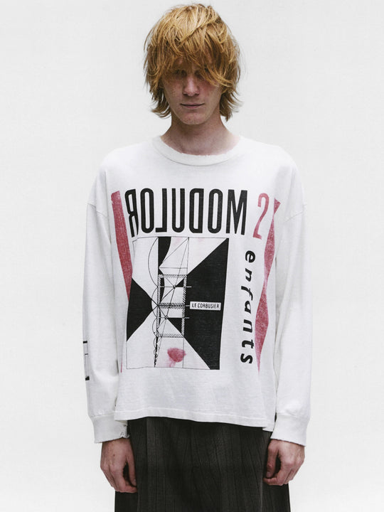 White t-shirt worn by a person, showing the shirt's fit