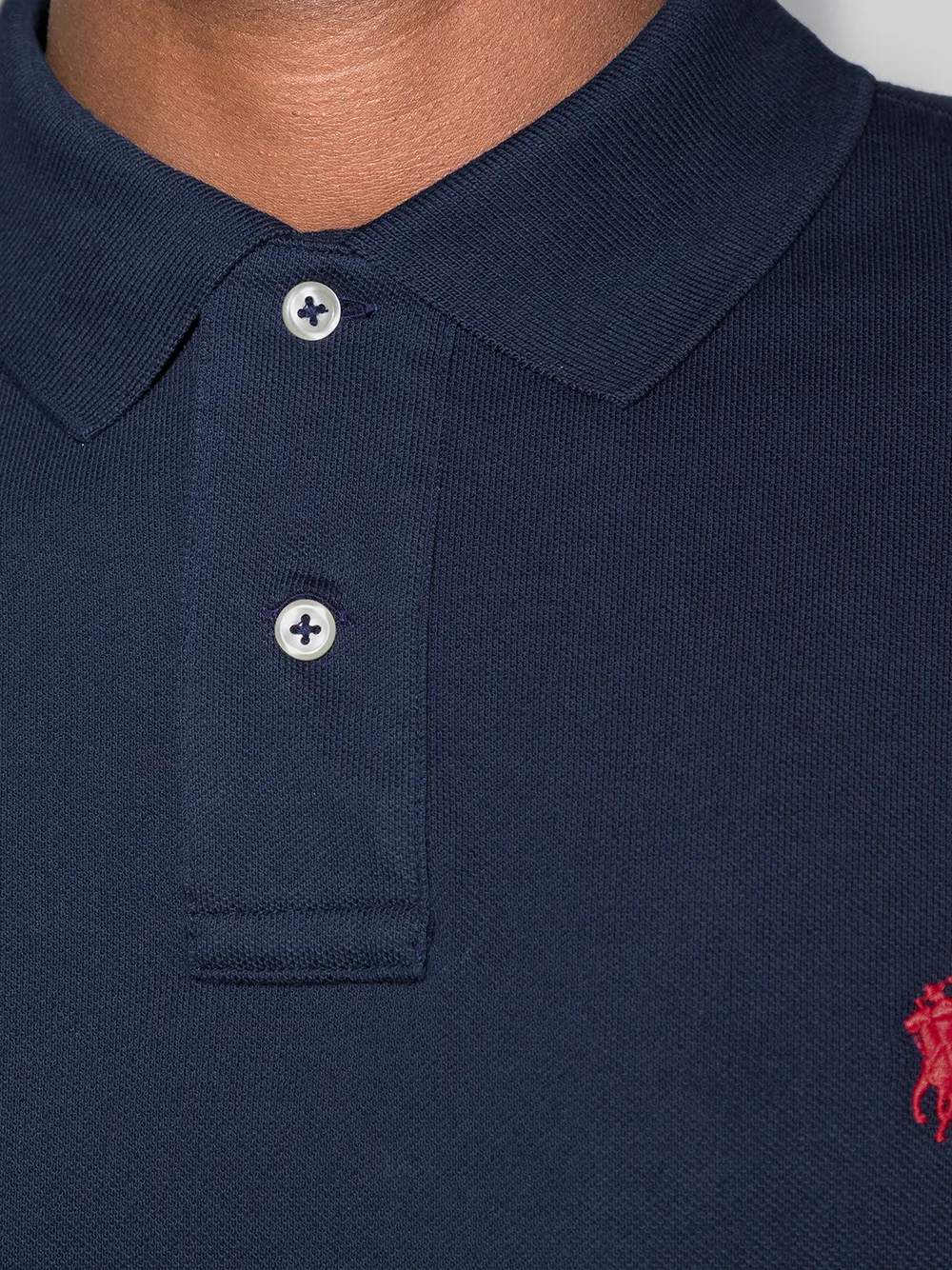 Close up of navy shirts,showing texture of the cotton fabric.