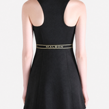 Black dress worn by a person, showing the dress fit