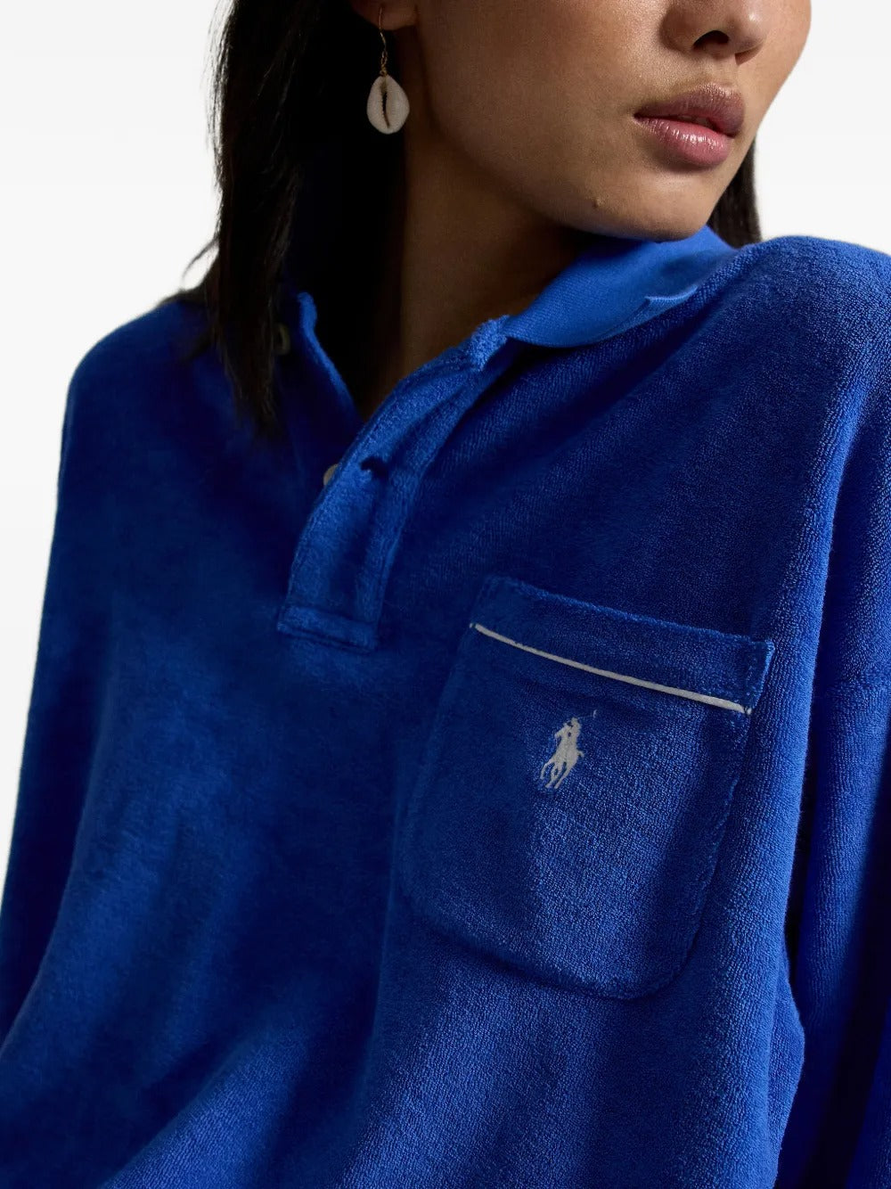 Close up of blue top, showing texture of the cotton fabric