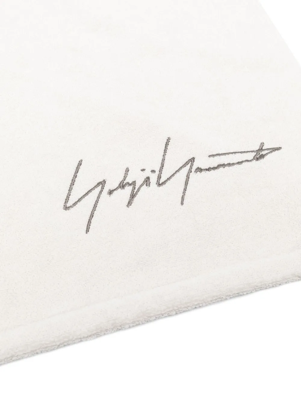 Close up of whtie towel, showing texture of the cotton fabric