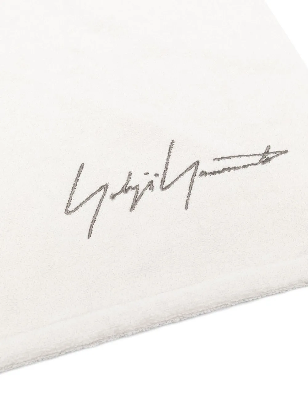 Close up of whtie towel, showing texture of the cotton fabric