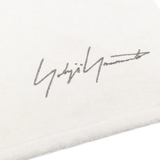 Close up of whtie towel, showing texture of the cotton fabric