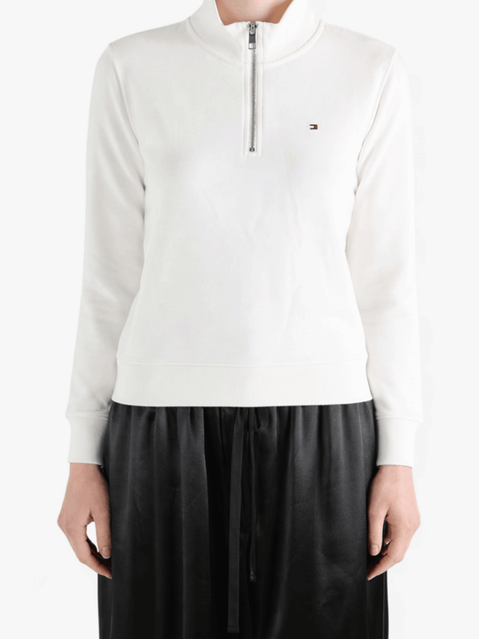 White sweats-hoodies worn by a person, showing the sweats-hoodies' fit 