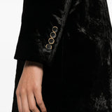 Black jacket worn by a person, showing the jacket fit