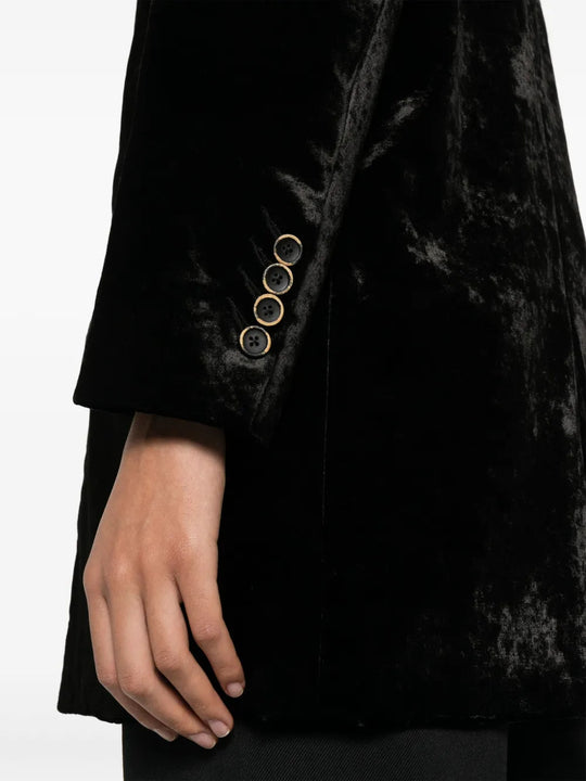 Black jacket worn by a person, showing the jacket fit