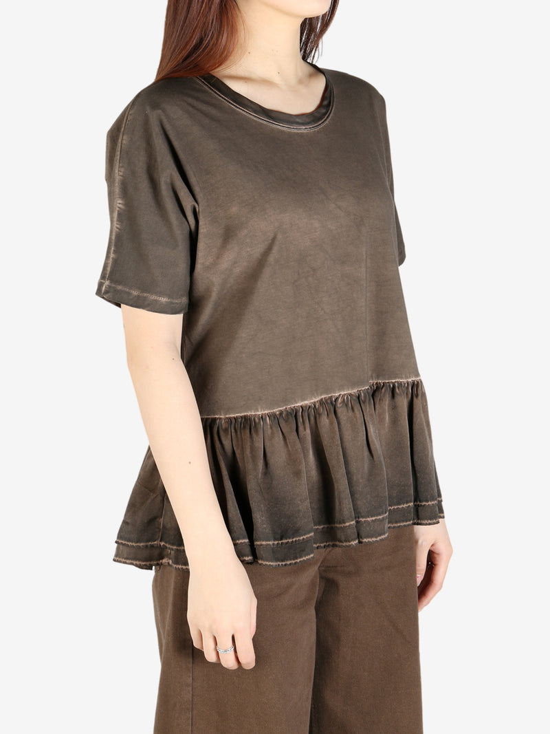 Brown top worn by a person, showing the top's fit