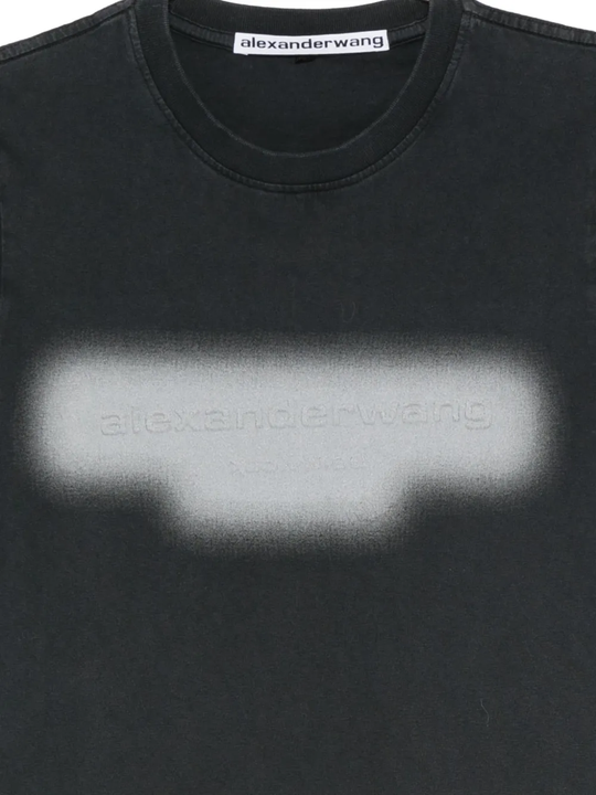 Close up of black t-shirt, showing texture of the Cotton fabric