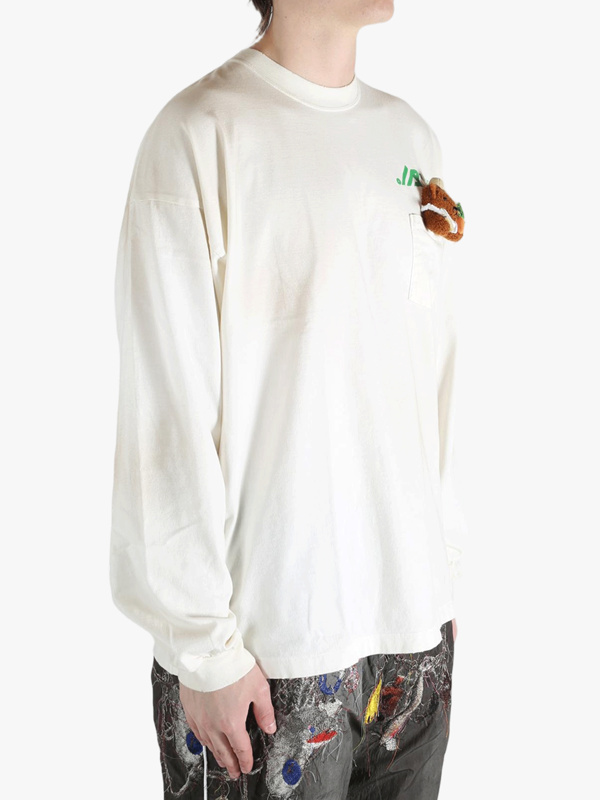 White t-shirt worn by a person, showing the t-shirt's fit