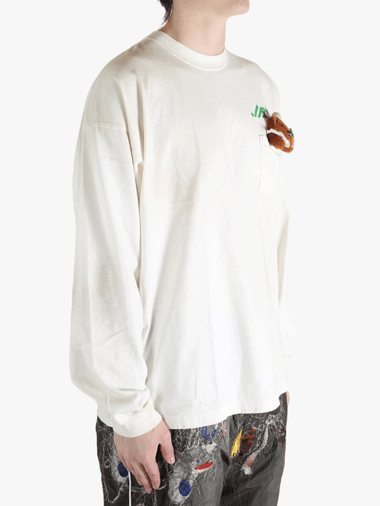 White t-shirt worn by a person, showing the t-shirt's fit