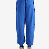 Blue pants worn by a person, showing the pants' fit