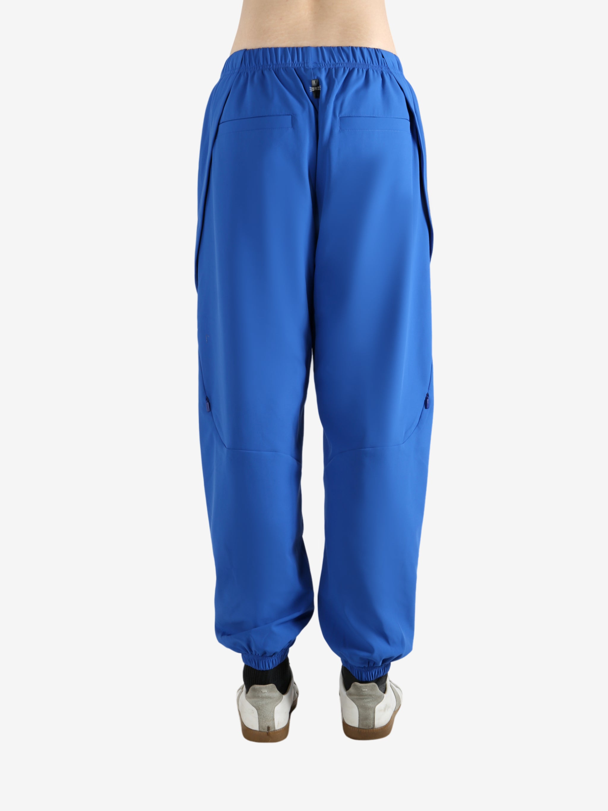 Blue pants worn by a person, showing the pants' fit