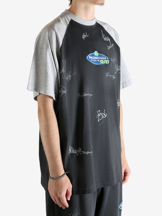 Black t-shirt worn by a person, showing the t-shirt's fit