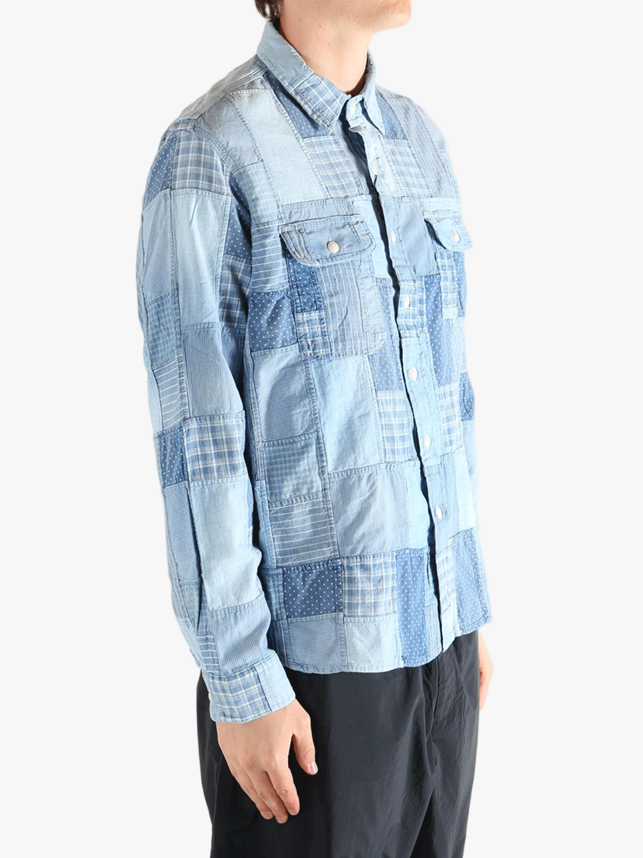 Blue shirt worn by a person, showing the shirt's fit