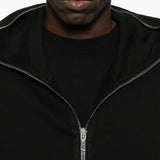 Close up of the black hoodie, showing texture of the cotton fabric