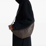 Brown bag worn by a person, showing the bag's fit