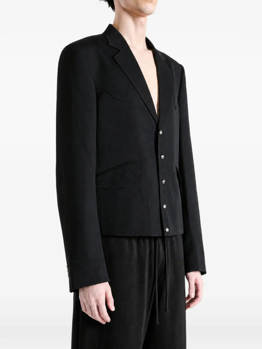 Black jacket worn by a person, showing the jacket fit