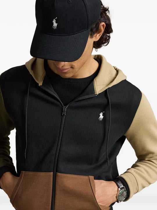 Black hoodie worn by a person, showing the hoodie fit