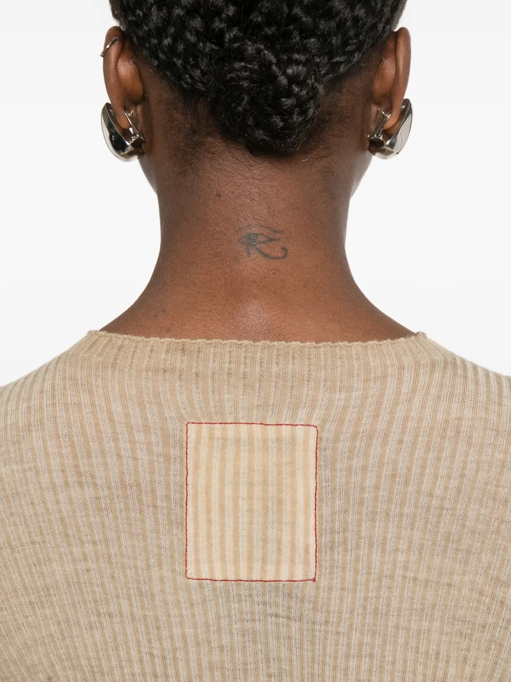 Close up of tan tops, showing texture of the wool fabric