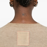 Close up of tan tops, showing texture of the wool fabric