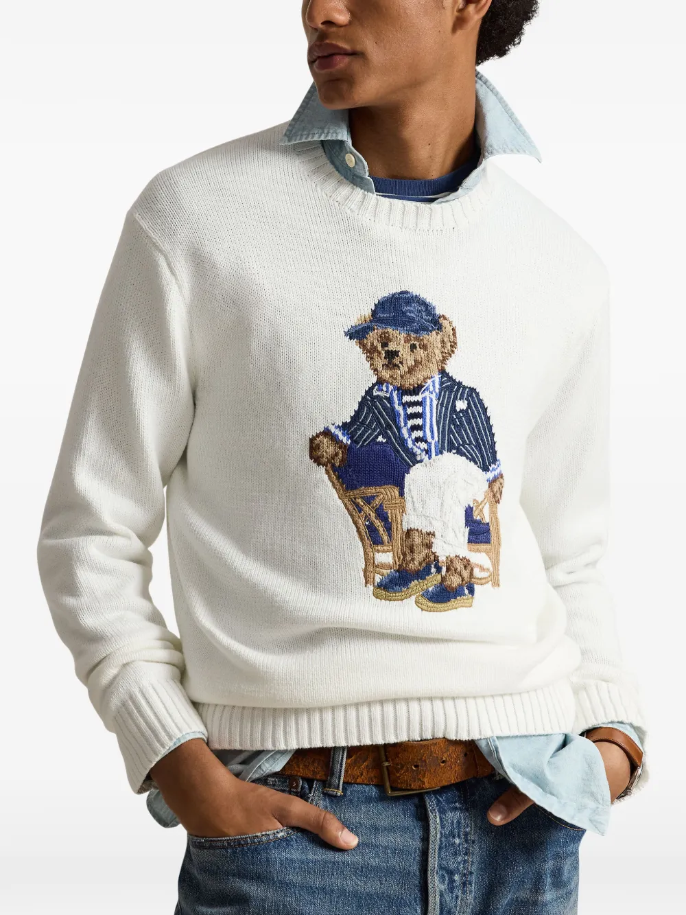 White sweater worn by a person, showing the sweater's fit