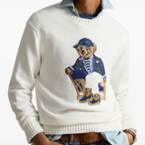 White sweater worn by a person, showing the sweater's fit