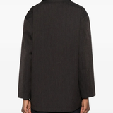 brown jackets-coats worn by a person, showing the  jackets-coats fit