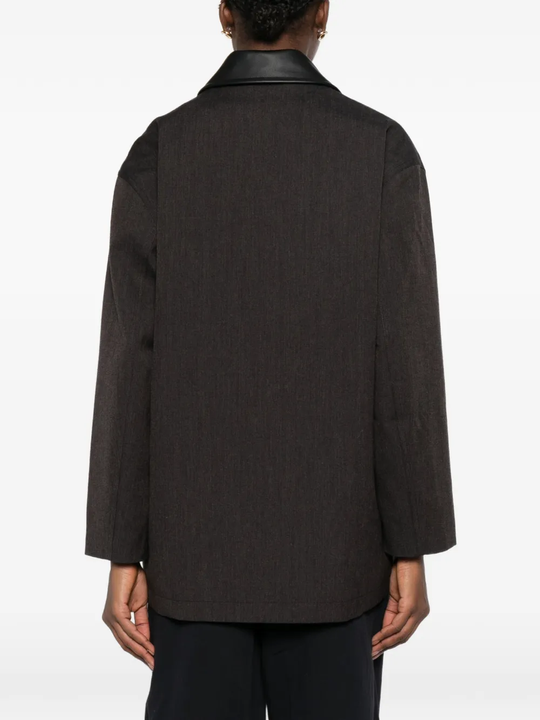 brown jackets-coats worn by a person, showing the  jackets-coats fit