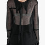 Black shirt worn by a person, showing the shirt fit