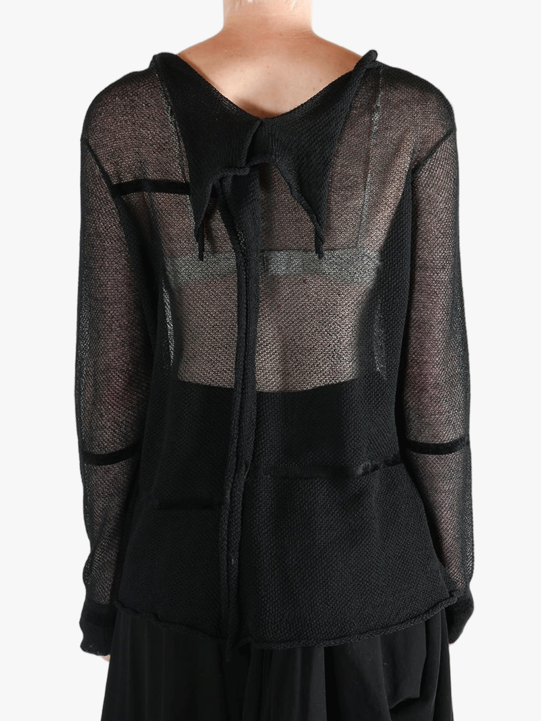 Black shirt worn by a person, showing the shirt fit