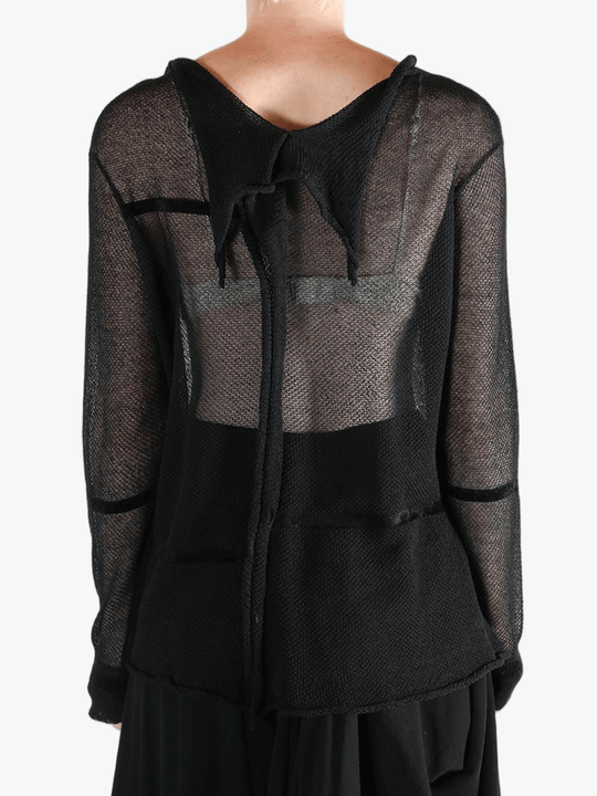 Black shirt worn by a person, showing the shirt fit