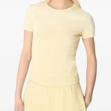 Yellow t-shirt worn by a person, showing the shirt's fit