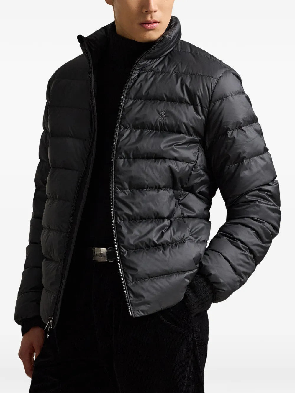 Black jacket worn by a person, showing the jacket fit