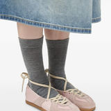 Tan shoes worn by a person, showing the shoes' fit
