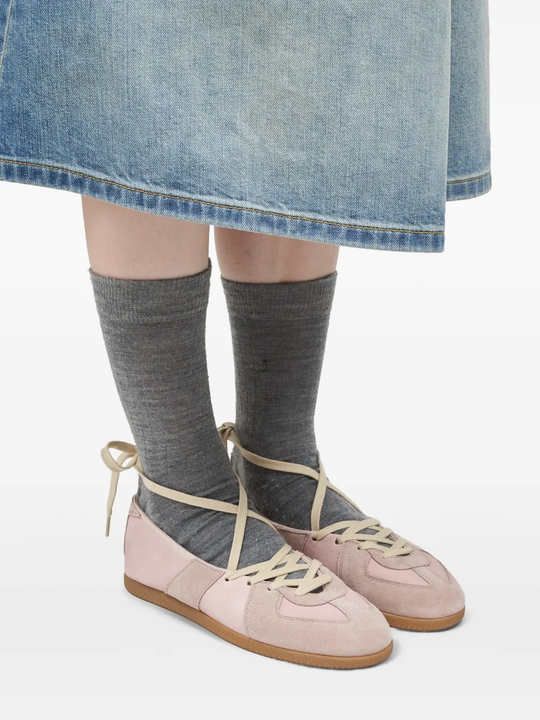 Tan shoes worn by a person, showing the shoes' fit