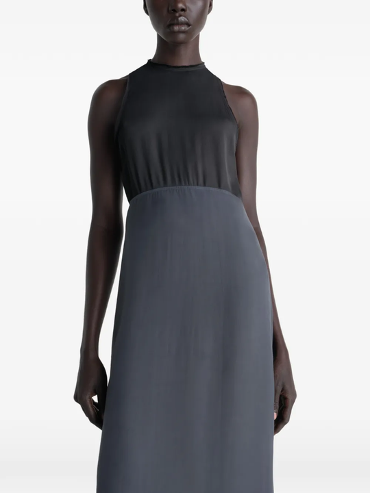 Grey dress worn by a person, showing the dress's fit