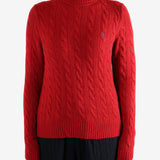 Red knitwear worn by a person, showing the knitwear's fit