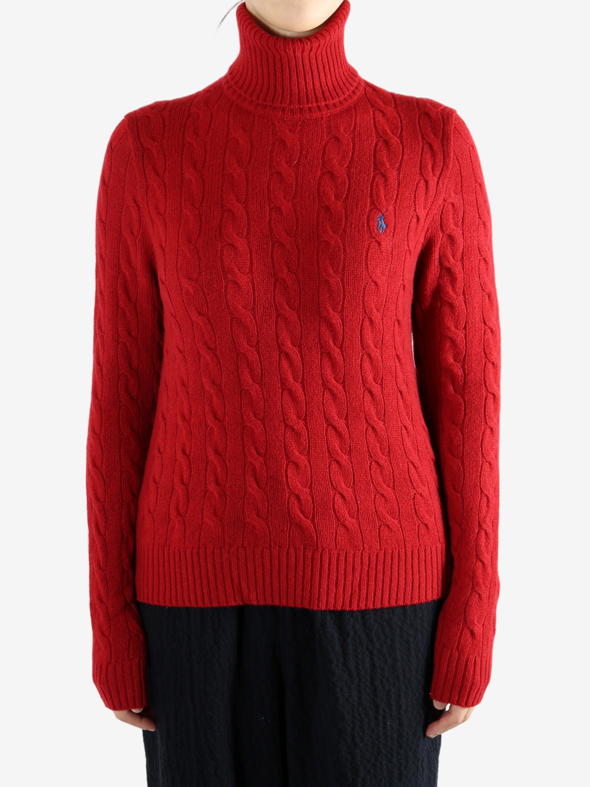 Red knitwear worn by a person, showing the knitwear's fit
