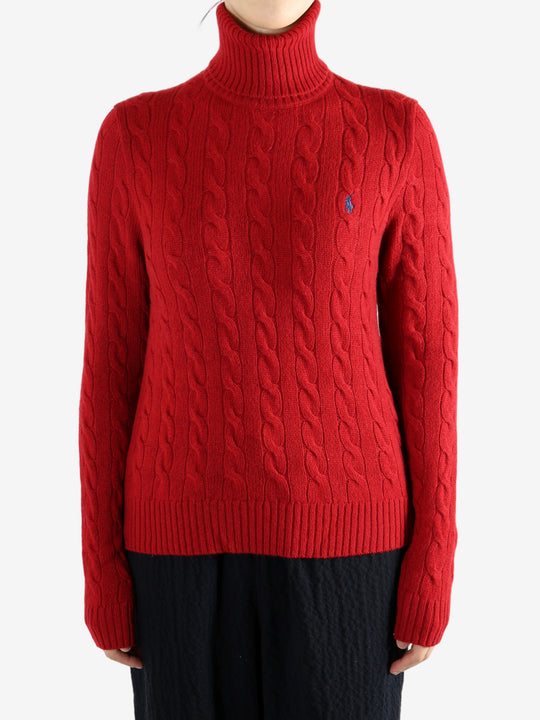 Red knitwear worn by a person, showing the knitwear's fit