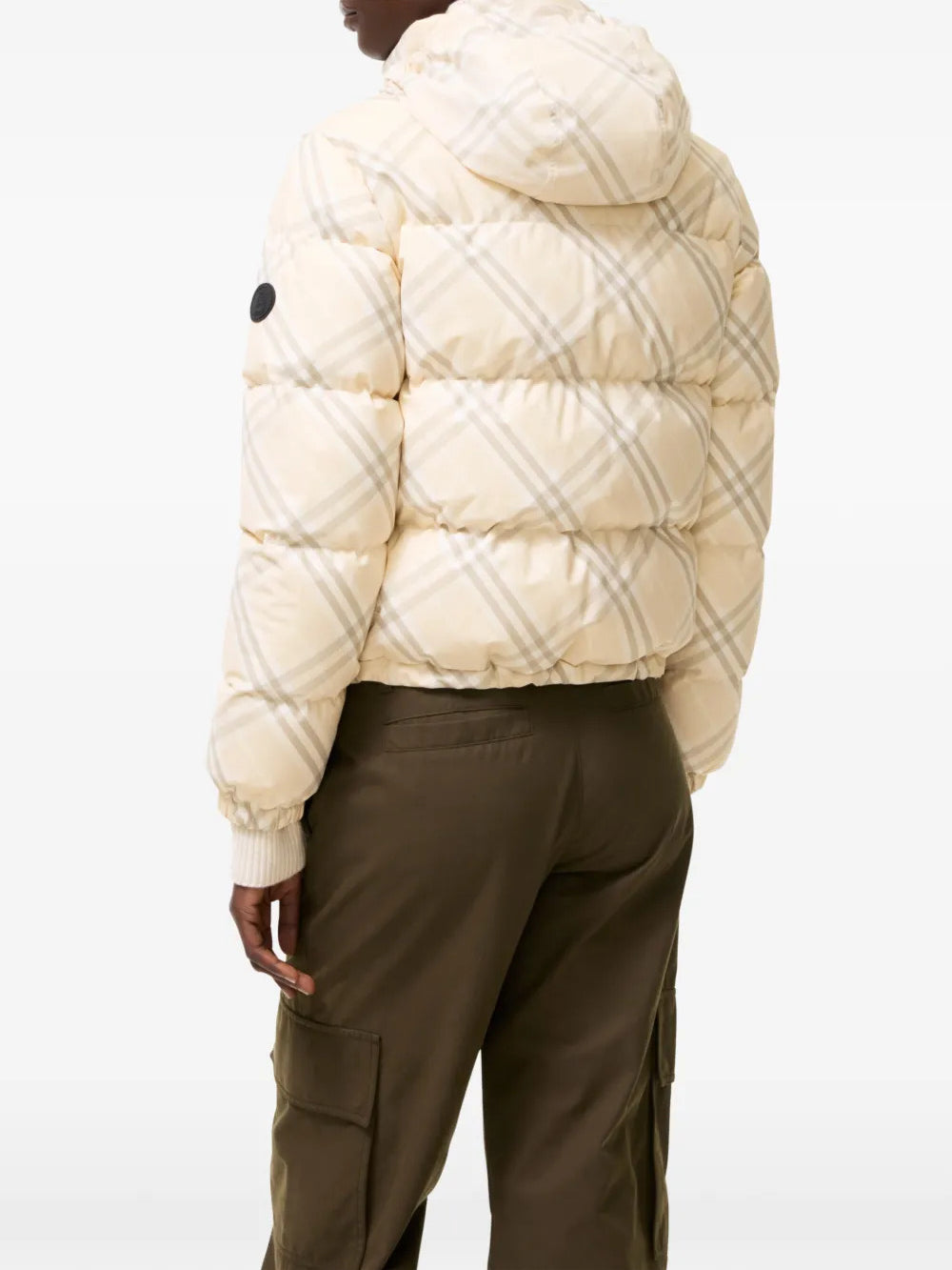 Tan jacket worn by a person, showing the jacket fit