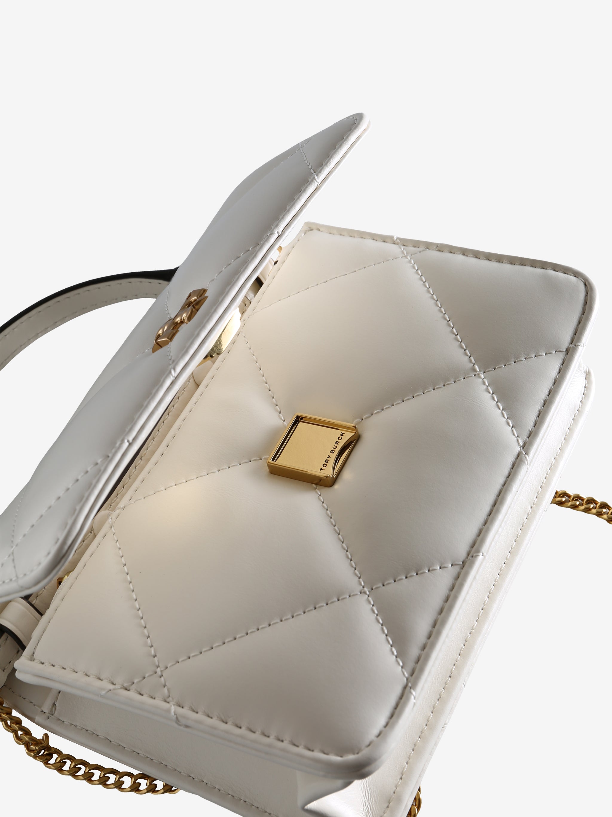 Close up of the white bag, showing texture of the leather fabric