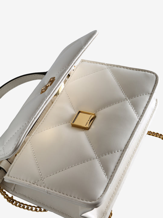 Close up of the white bag, showing texture of the leather fabric