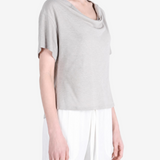Grey knitwear worn by a person, showing the knitwear fit