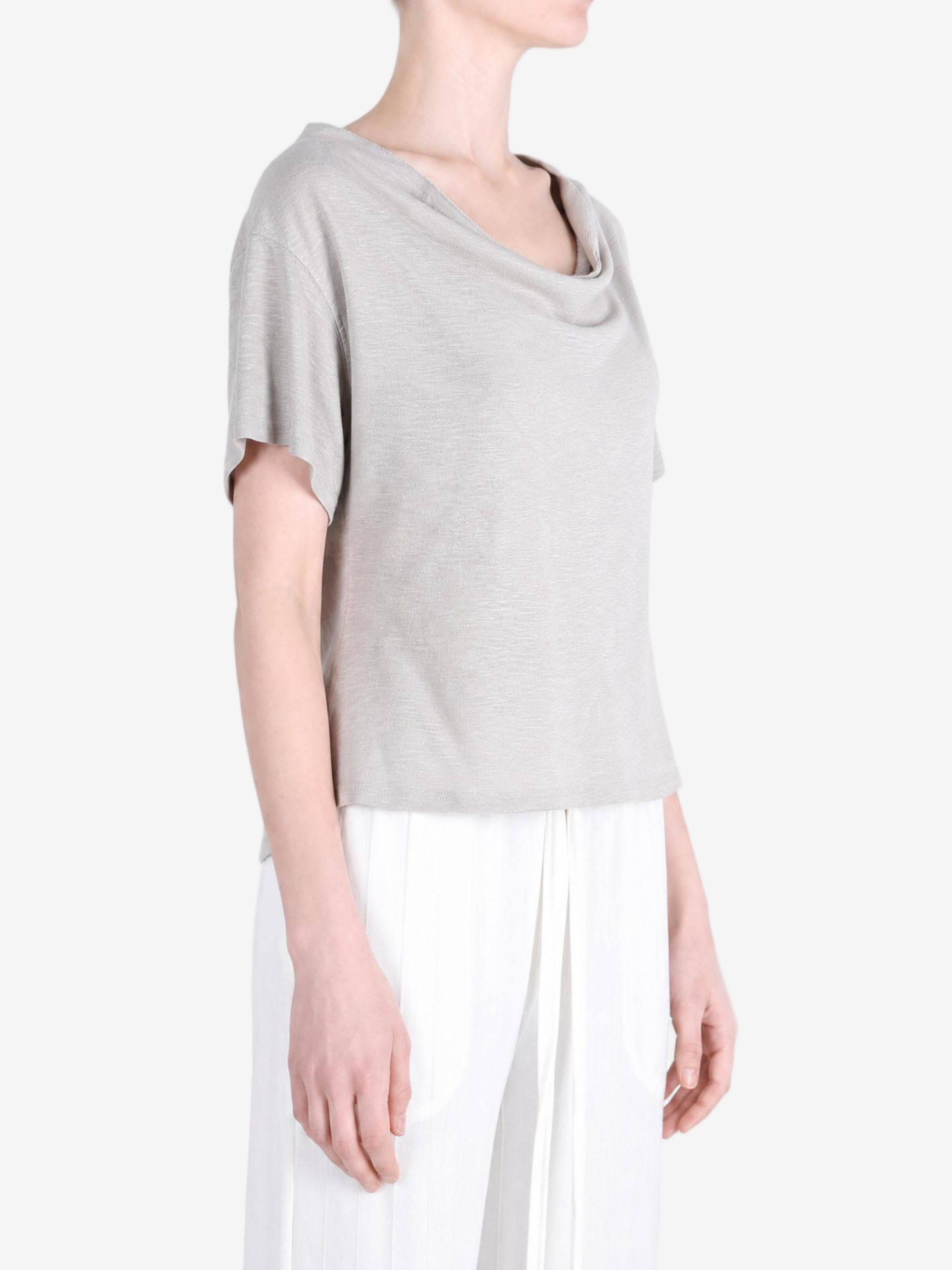 Grey knitwear worn by a person, showing the knitwear fit